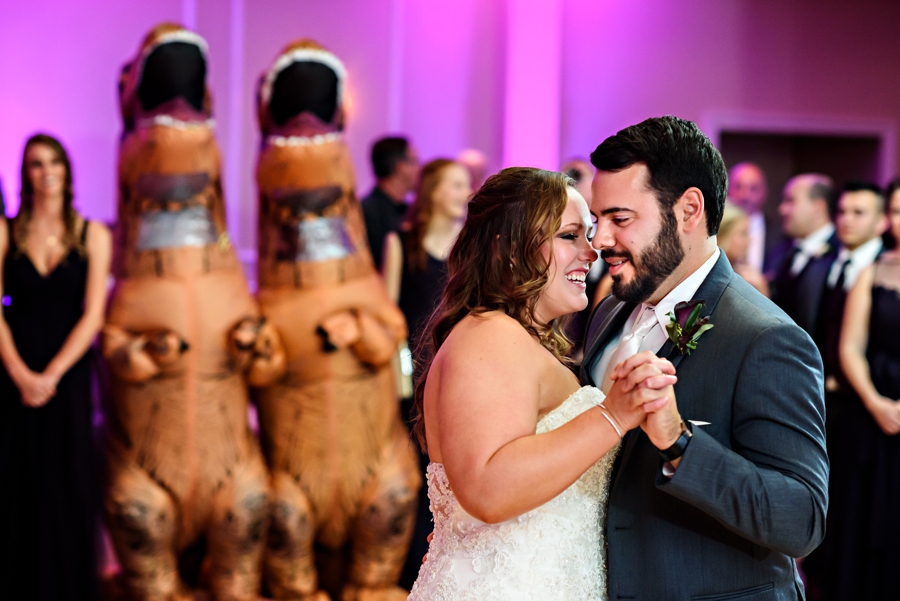 A bride and groom dance their first dance at their reception at the manor house at commonwealth.